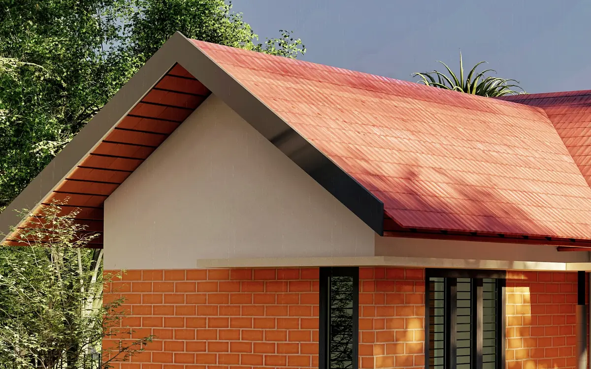 Sandeep Residence, Cherthala — a steep terracotta-tiled roof over exposed brick